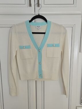 CHANEL Cream Cardigan with Light Blue Trim and Signature Buttons